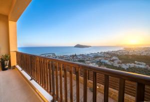 a balcony with a view of the ocean at Golden View Luxury Villa Platanias in Plataniás