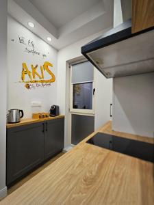 a kitchen with a sink and a counter top at Akis CityChic Apartment in Cluj-Napoca