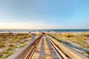 a wooden boardwalk leading to the beach at Ocean Mile B2 in St. George Island