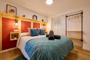 a bedroom with a bed with a stuffed animal on it at El Deseo in Zuheros