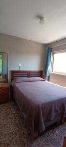Postel nebo postele na pokoji v ubytování Hostal Arica 3 + 9 fotografií