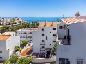 a white building with a view of the ocean at Lovely 3BD 150m Beach Ocean View AC Wi-Fi Balcony in Albufeira