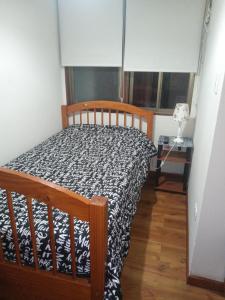 Säng eller sängar i ett rum på Habitación casa familia