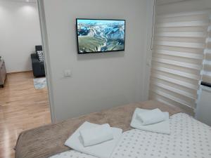 Postel nebo postele na pokoji v ubytování Lider Lux Apartman