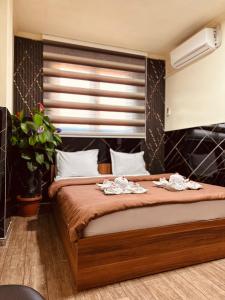 Een bed of bedden in een kamer bij Motel Atika