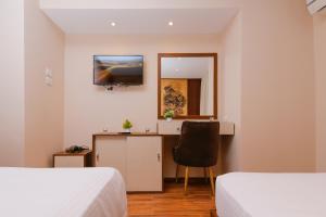 Voodi või voodid majutusasutuse Sky Pyramids View Inn toas
