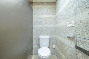 a bathroom with a white toilet in a room at From H Oceanpalace Hotel Jeju in Seogwipo