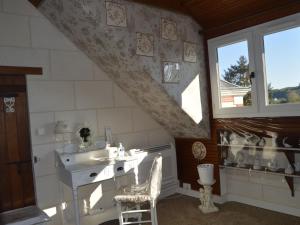 a bathroom with a sink and a window at Guestroom Valençay, 2 pièces, 4 personnes - FR-1-591-392 in Valençay