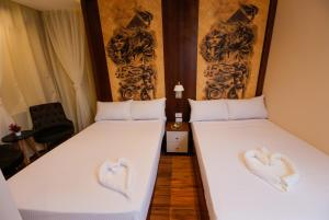 Voodi või voodid majutusasutuse Sky Pyramids View Inn toas