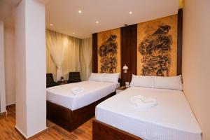Voodi või voodid majutusasutuse Sky Pyramids View Inn toas