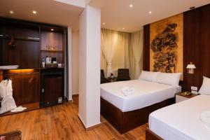 Voodi või voodid majutusasutuse Sky Pyramids View Inn toas