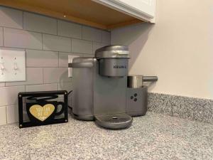 a coffee maker sitting on a counter in a kitchen at Modern 1br - 15 from Airport in Stockbridge