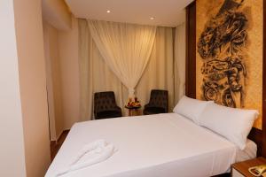 Voodi või voodid majutusasutuse Sky Pyramids View Inn toas