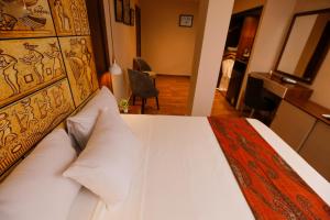 Voodi või voodid majutusasutuse Sky Pyramids View Inn toas