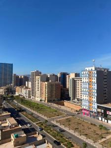 a view of a city with a highway and buildings at Résidence kadicia oran in Oran