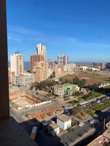 a view of a city with tall buildings and a street at Résidence kadicia oran in Oran