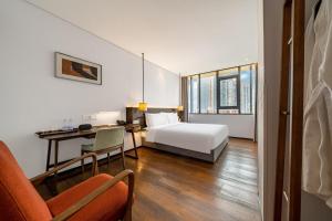 Wuyu Hotel - Chongqing Jiangbei Airport & Light Rail客房内的一张或多张床位