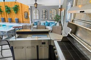 a kitchen with a stove and a living room at 1234 New Orleans in New Orleans