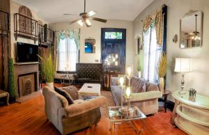 a living room with two couches and a fireplace at 1234 New Orleans in New Orleans