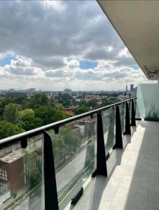 a balcony with a view of a city at Vista Mágica Cdmx 1 in Mexico City