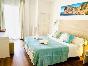 Postel nebo postele na pokoji v ubytování Hotel Miramar