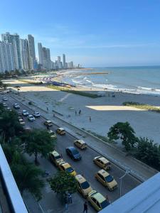 a parking lot with cars parked next to the beach at BARLOVENTO in Cartagena de Indias