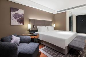 Voodi või voodid majutusasutuse Intercity Hotel Futian Bin He Zhongzhou Bay toas