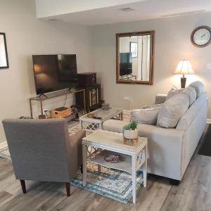 a living room with a couch and a tv at Newly Remodeled 2BR 2BA Home - Close to Barrington in Barrington