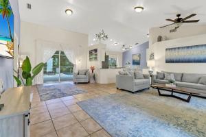 a living room with two couches and a table at 363 Marco Island in Marco Island