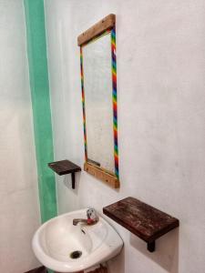 a bathroom with a sink and a mirror at Dadods homestay in General Luna