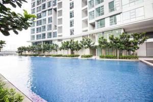 a large swimming pool in front of a building at Robertson Suites by Sleepy Bear, Bukit Bintang in Kuala Lumpur