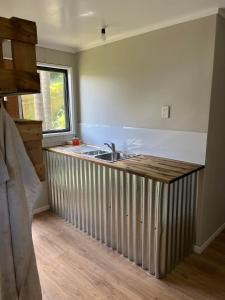 a kitchen with a sink and a counter top at Huriana Place in Kaitaia