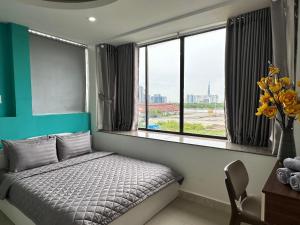 Postel nebo postele na pokoji v ubytování Thắng Hà Hotel