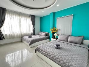 Postel nebo postele na pokoji v ubytování Thắng Hà Hotel