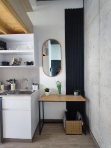 a bathroom with a sink and a mirror at Chic Loft en Chapinero in Bogotá