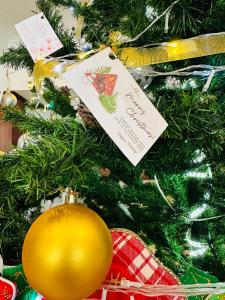 a christmas tree with a card on it at Century Riverside Hue in Hue