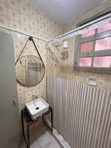 a bathroom with a sink and a shower at Sambódromo Lapa Santa Teresa Centro in Rio de Janeiro