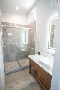 a bathroom with a shower and a sink at The Drift in Pagosa Springs