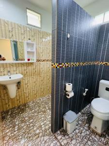 a bathroom with a toilet and a sink at AJ Paradise Resort Aonang Krabi in Ao Nang Beach