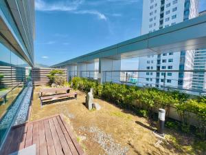 a balcony of a building with two benches on it at Busan Centurn Victoria hotel in Busan