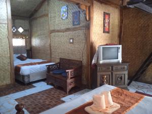 Letto o letti in una camera di Yoschi's Hotel Bromo