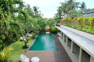 a swimming pool on the balcony of a resort at Villa Sally in Canggu
