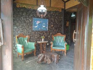 Area soggiorno di Yoschi's Hotel Bromo
