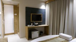 Postel nebo postele na pokoji v ubytování HOTEL AMBER PARAMOUNT