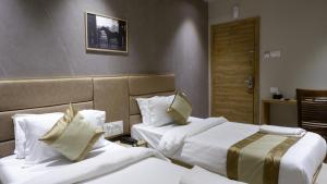 Postel nebo postele na pokoji v ubytování HOTEL AMBER PARAMOUNT