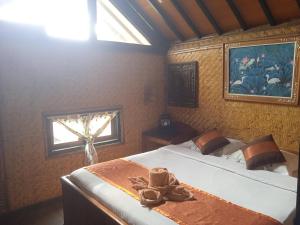 Letto o letti in una camera di Yoschi's Hotel Bromo