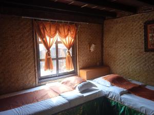 Letto o letti in una camera di Yoschi's Hotel Bromo