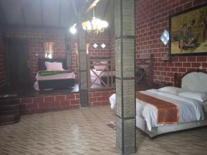 Letto o letti in una camera di Yoschi's Hotel Bromo