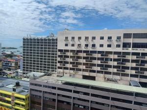 a view of two tall buildings in a city at Kinabalu Daya Hotel in Kota Kinabalu