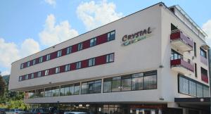 a large white building with a sign on it at Appartementhaus Crystal by Schladming-Appartements in Schladming